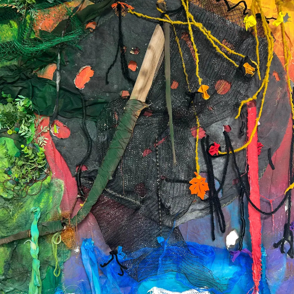 Fire element represented with dark netting and repurposed materials in Echoes of Nature