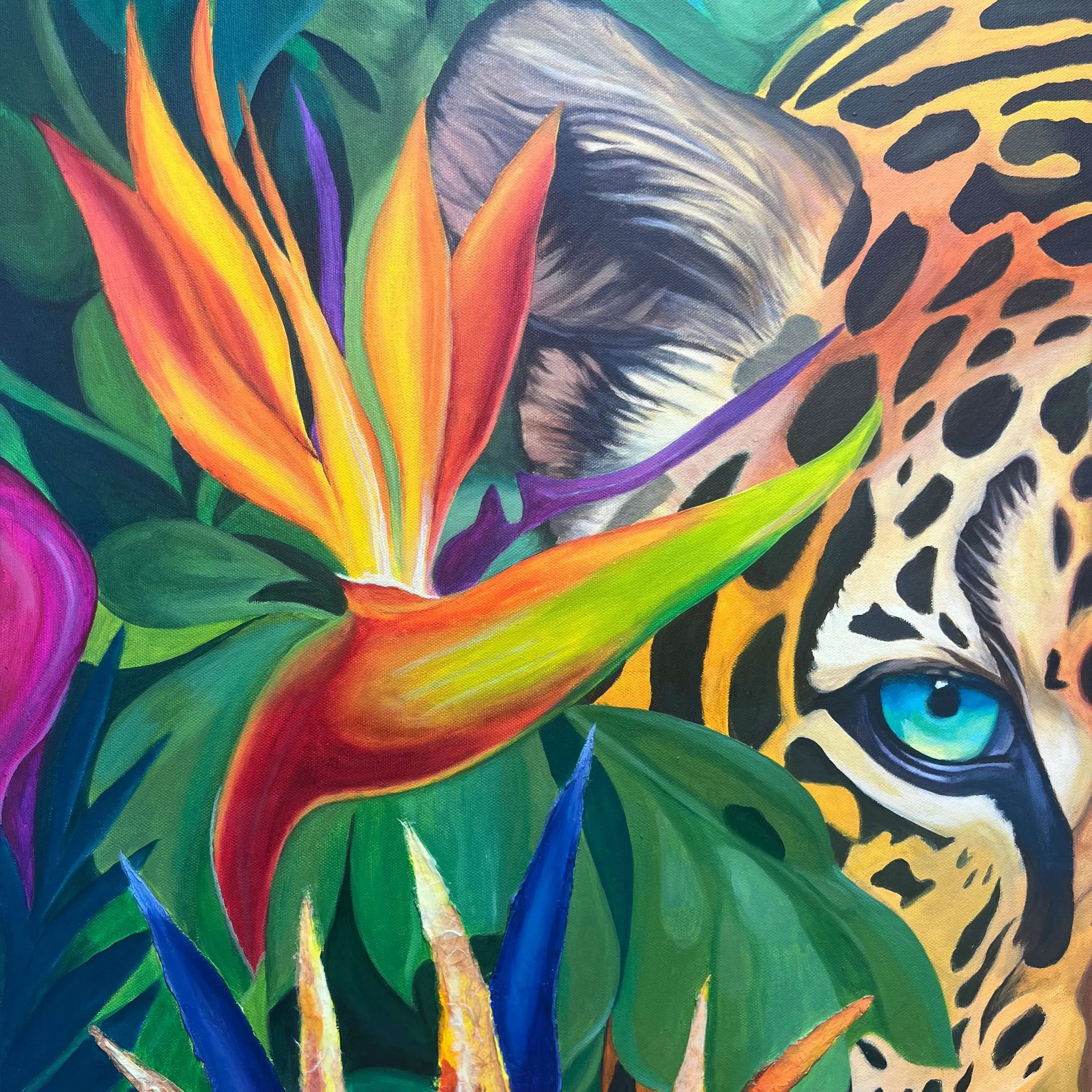 Jaguar eye and tropical Bird of Paradise flower detail in Wild Essence